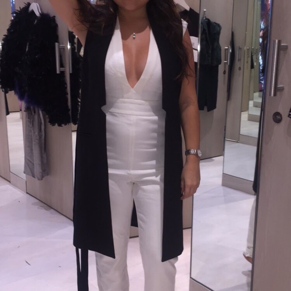 Bebe off-white Jumpsuit with plunging neckline.